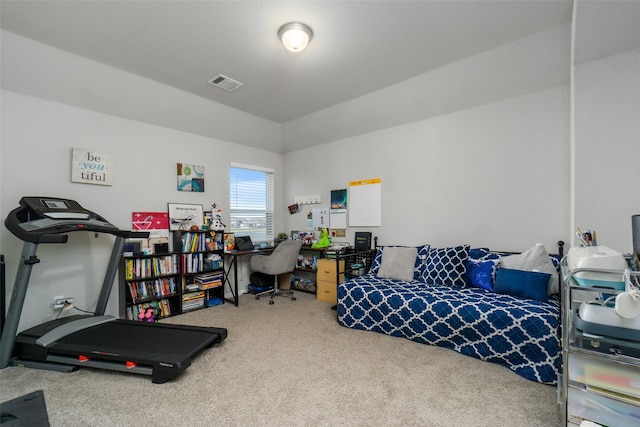 carpeted bedroom featuring vaulted ceiling and visible vents