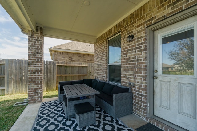 view of patio featuring an outdoor hangout area and fence
