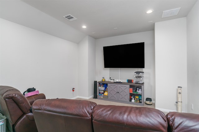 carpeted living area featuring baseboards, visible vents, and recessed lighting