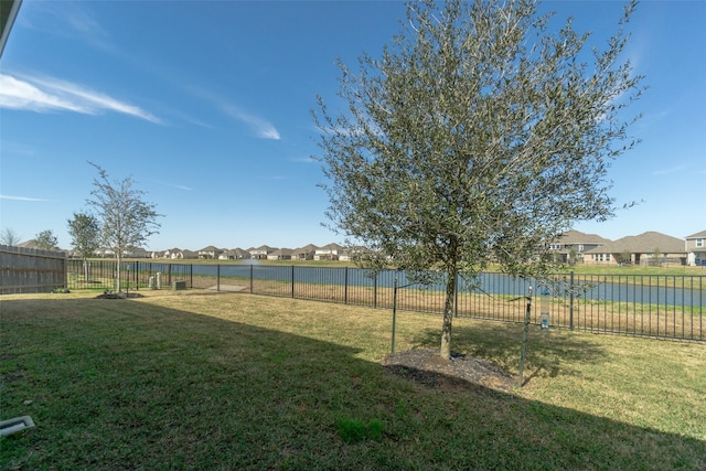 view of yard featuring a fenced backyard and a residential view