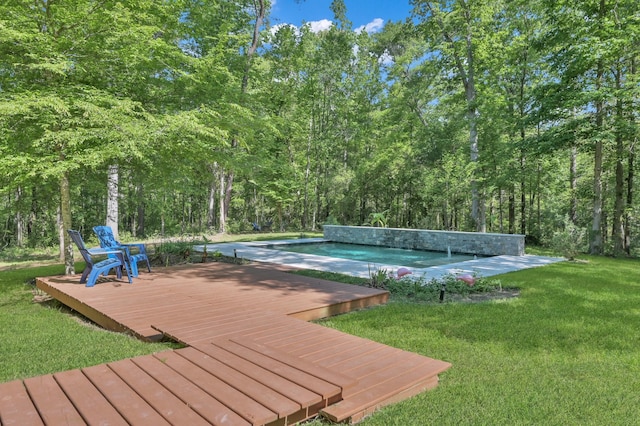pool featuring a yard and a deck