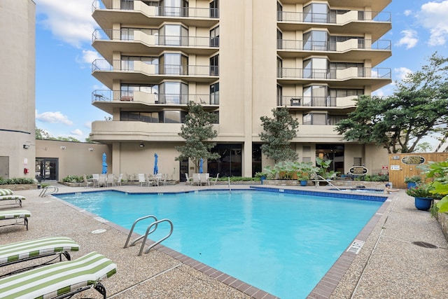 community pool with a patio