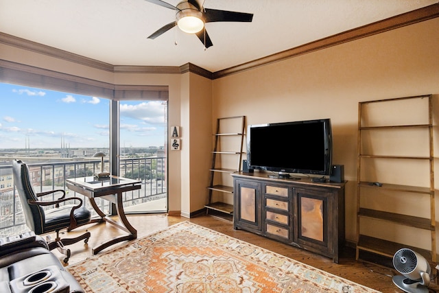 office area with baseboards, wood finished floors, ceiling fan, and crown molding