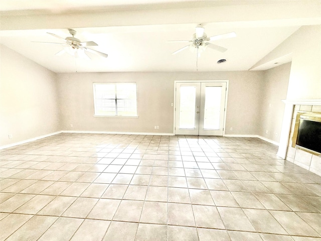 1206 Kent St, Sweeny, TX 77480 - unfurnished living room with vaulted ceiling, visible vents, a ceiling fan, light tile patterned floors, and a fireplace