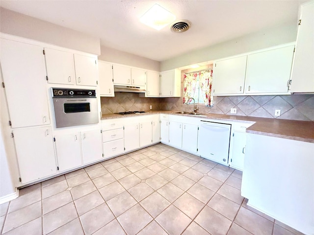 1206 Kent St, Sweeny, TX 77480 - kitchen with a sink, stainless steel oven, dishwasher, under cabinet range hood, and visible vents