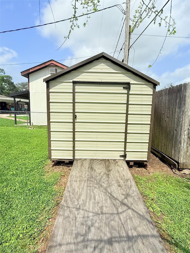 1206 Kent St, Sweeny, TX 77480 - garage featuring a storage shed and fence