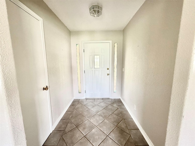 1206 Kent St, Sweeny, TX 77480 - doorway to outside featuring tile patterned floors and baseboards