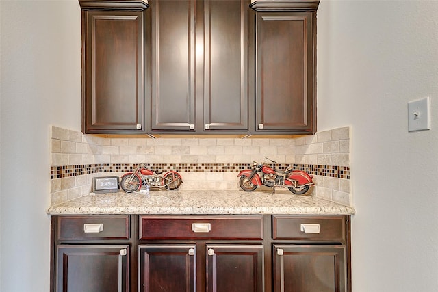 bar featuring decorative backsplash