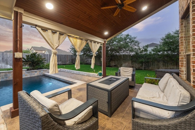 view of patio with a fenced in pool, a fenced backyard, ceiling fan, and an outdoor living space