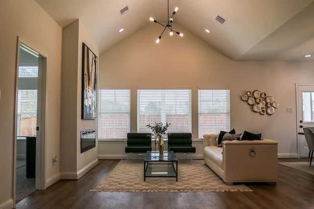 living room with dark wood finished floors, an inviting chandelier, visible vents, and plenty of natural light