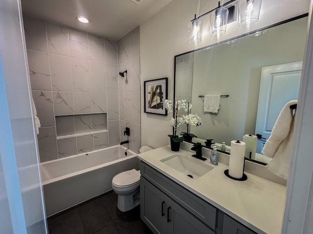 bathroom featuring toilet, vanity, tile patterned floors, and shower / bathing tub combination