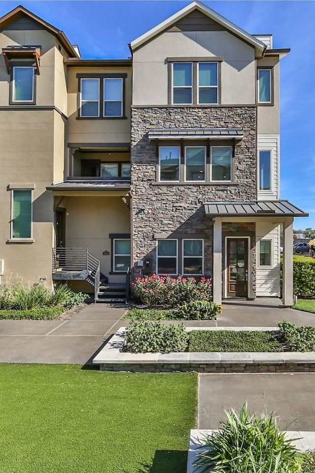 2660 Fountain Key Blvd, Houston, TX 77008 - townhome / multi-family property featuring stucco siding and stone siding
