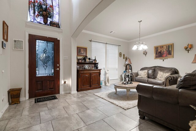 3203 Jeanette Cir, Mont Belvieu, TX 77523 - entryway with a chandelier, ornamental molding, baseboards, and arched walkways