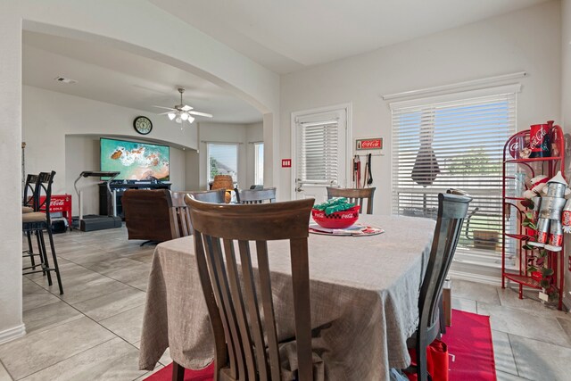 3203 Jeanette Cir, Mont Belvieu, TX 77523 - dining room featuring arched walkways and ceiling fan