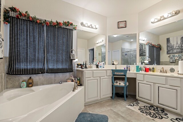 3203 Jeanette Cir, Mont Belvieu, TX 77523 - bathroom with a garden tub, a shower stall, vanity, and tile patterned flooring