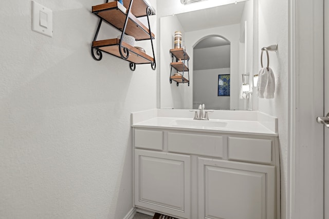 3203 Jeanette Cir, Mont Belvieu, TX 77523 - bathroom featuring vanity and a textured wall