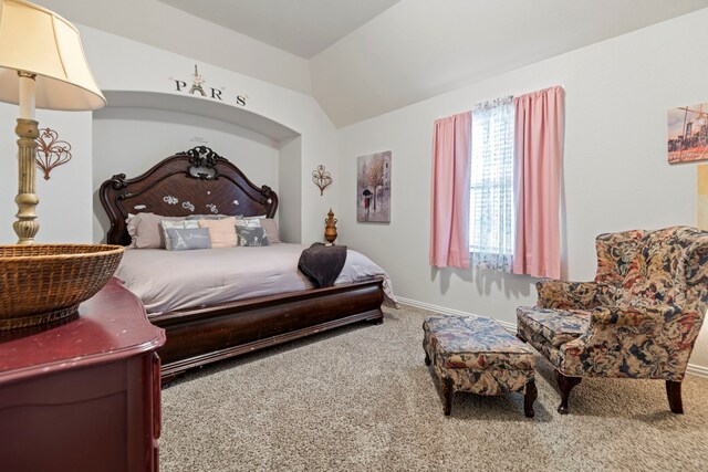 3203 Jeanette Cir, Mont Belvieu, TX 77523 - carpeted bedroom with baseboards and lofted ceiling