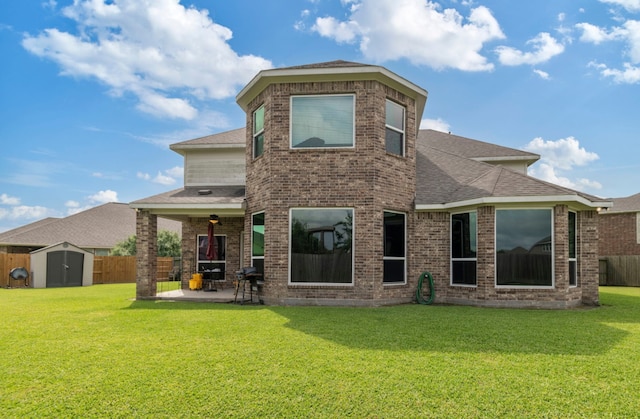 3203 Jeanette Cir, Mont Belvieu, TX 77523 - back of property featuring a patio, brick siding, and roof with shingles