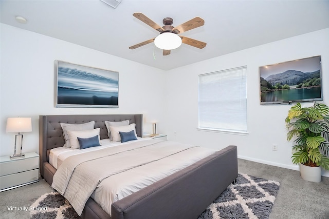 carpeted bedroom with baseboards and ceiling fan