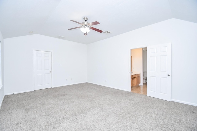 bonus room with vaulted ceiling, a ceiling fan, light colored carpet, baseboards, and visible vents