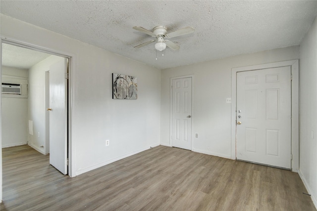 5409 Suez St Unit 4, Houston, TX 77020 - spare room with ceiling fan, baseboards, a textured ceiling, and light wood finished floors