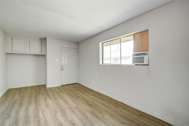 5409 Suez St Unit 4, Houston, TX 77020 - unfurnished room with light wood-type flooring, cooling unit, and baseboards