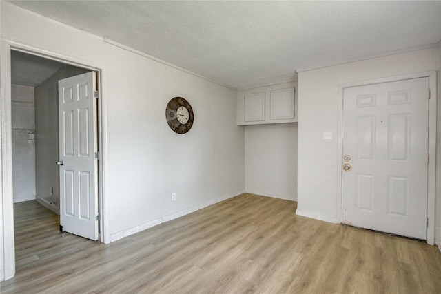 5409 Suez St Unit 4, Houston, TX 77020 - unfurnished room with light wood finished floors and baseboards
