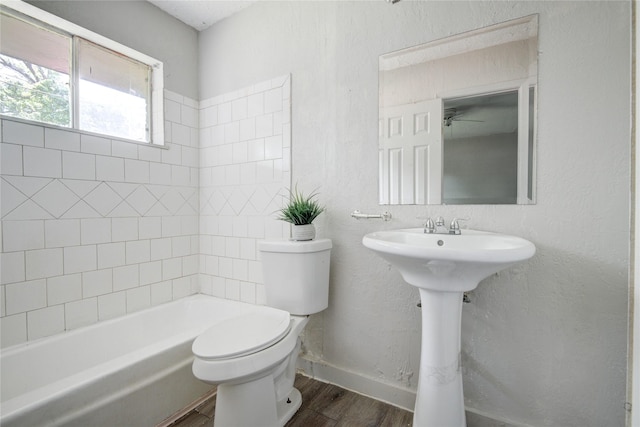 5409 Suez St Unit 4, Houston, TX 77020 - full bathroom featuring baseboards, wood finished floors, and toilet