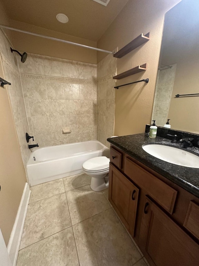 full bathroom featuring tile patterned floors, vanity,  shower combination, and toilet