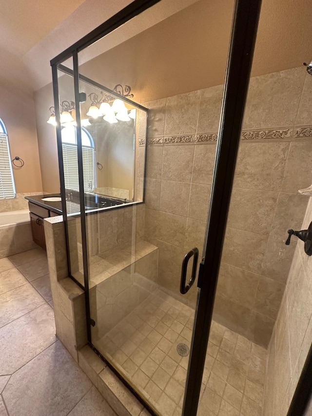 full bathroom with a garden tub, vanity, tile patterned flooring, and a shower stall