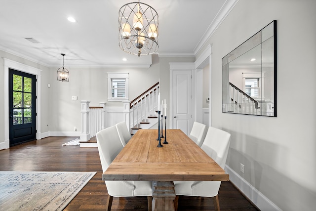 dining space featuring visible vents, an inviting chandelier, and stairway