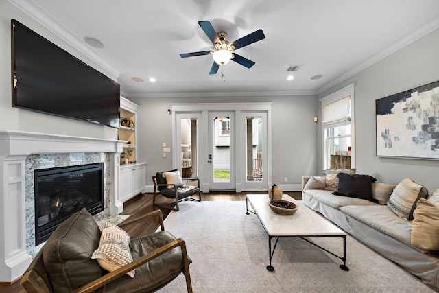 living room featuring visible vents, recessed lighting, ceiling fan, and crown molding