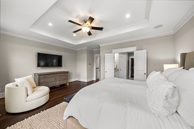 bedroom featuring baseboards, a tray ceiling, recessed lighting, and dark wood finished floors