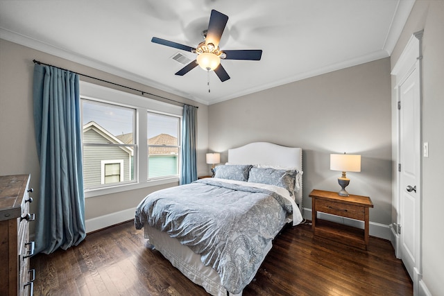 bedroom featuring crown molding, ceiling fan, baseboards, dark wood-style flooring, and visible vents