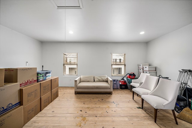 sitting room featuring attic access, recessed lighting, light wood-style floors, and a healthy amount of sunlight