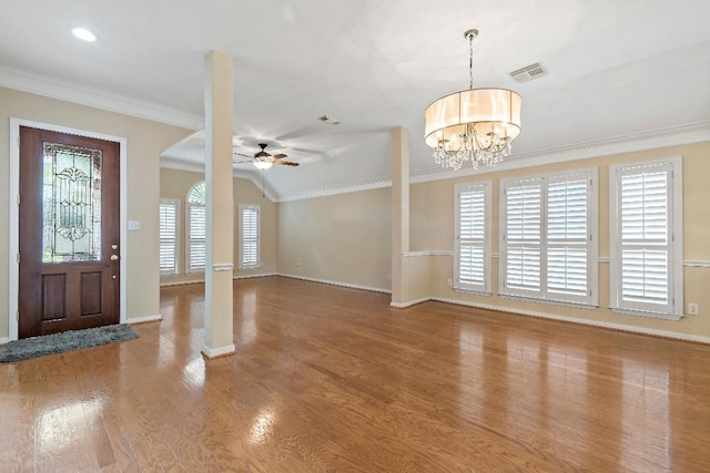 2538 Silent Shore Ct, Richmond, TX 77406 - entryway featuring baseboards, a ceiling fan, crown molding, wood finished floors, and a chandelier