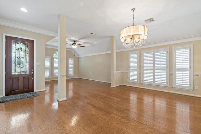 2538 Silent Shore Ct, Richmond, TX 77406 - entryway featuring baseboards, a ceiling fan, crown molding, wood finished floors, and a chandelier