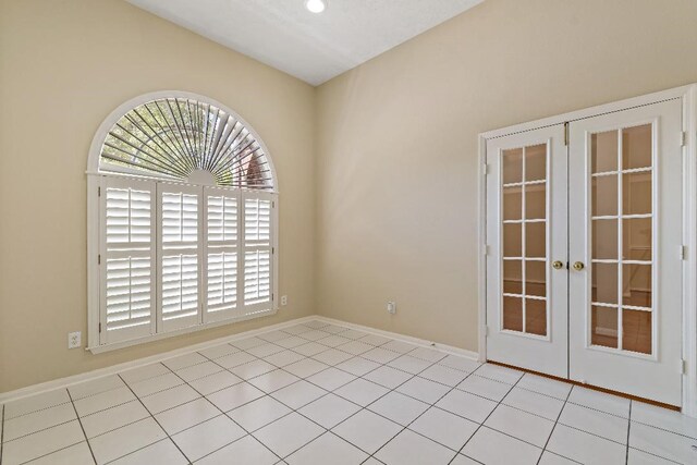 2538 Silent Shore Ct, Richmond, TX 77406 - unfurnished room with french doors, baseboards, and light tile patterned floors