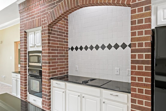 2538 Silent Shore Ct, Richmond, TX 77406 - kitchen featuring black appliances, dark countertops, white cabinets, and backsplash