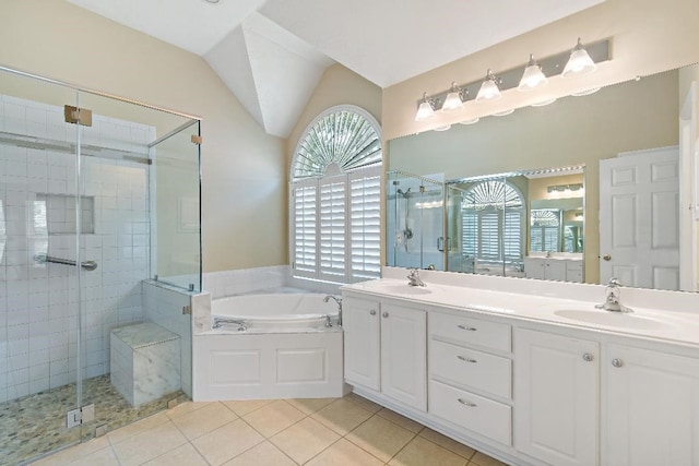 2538 Silent Shore Ct, Richmond, TX 77406 - bathroom featuring a stall shower, a bath, double vanity, tile patterned floors, and lofted ceiling