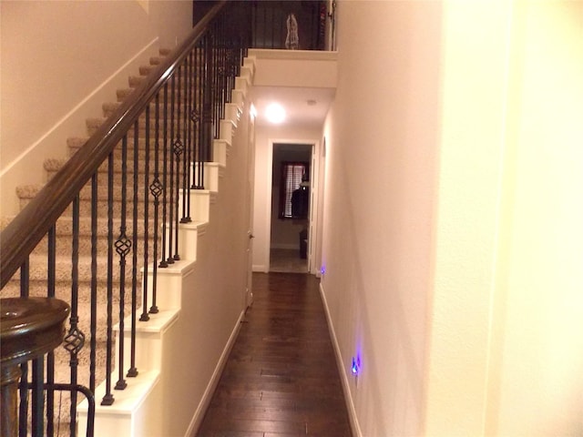 23423 Tavola Rosa Dr, New Caney, TX 77357 - corridor featuring baseboards, dark wood-style flooring, and stairway