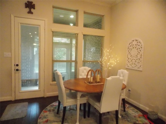 23423 Tavola Rosa Dr, New Caney, TX 77357 - dining area with baseboards, wood finished floors, and crown molding