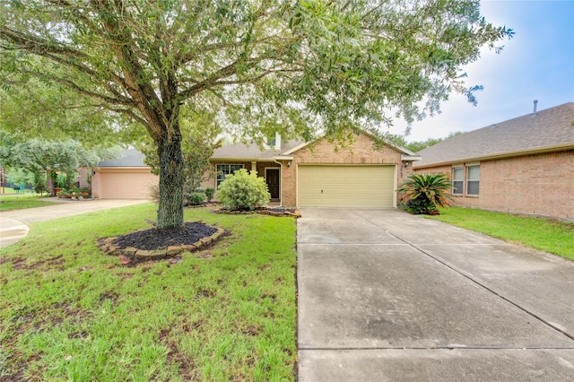 single story home with concrete driveway, an attached garage, and a front lawn