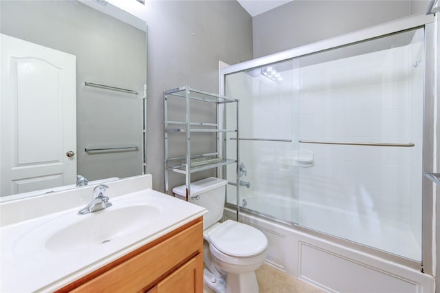 full bathroom with toilet, vanity, and enclosed tub / shower combo