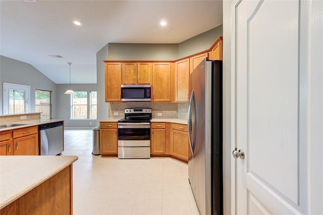 kitchen featuring backsplash, light countertops, appliances with stainless steel finishes, and recessed lighting