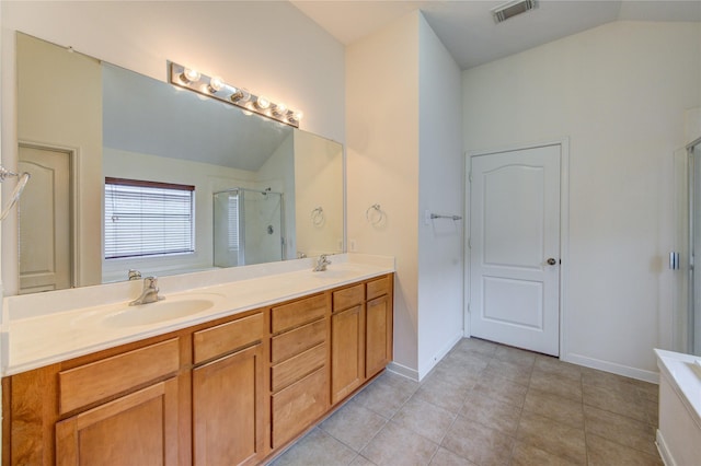 full bathroom featuring lofted ceiling, visible vents, a sink, and a stall shower
