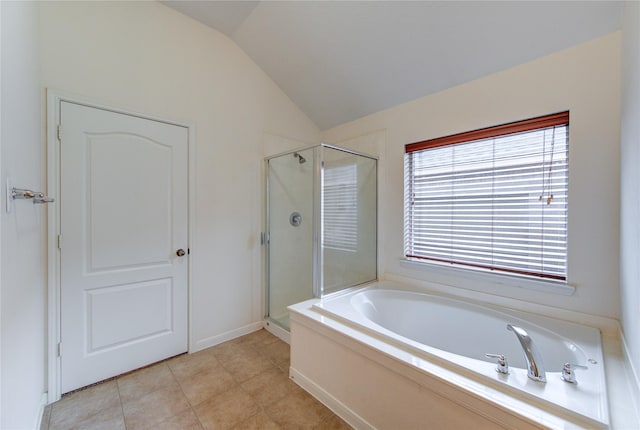 full bathroom with a bath, vaulted ceiling, and a stall shower