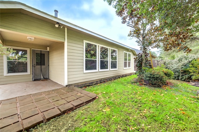 exterior space with a yard and a patio