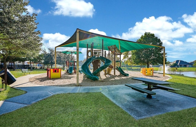 communal playground featuring a yard