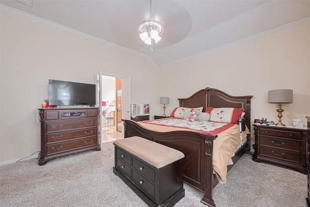 bedroom featuring crown molding, light carpet, lofted ceiling, and ensuite bath
